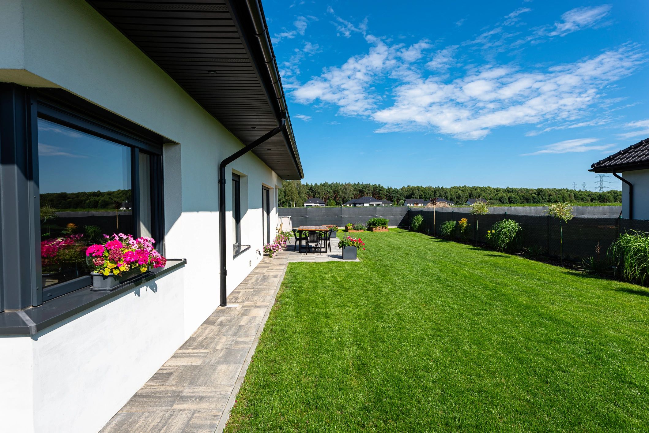 Luxury estate home with expansive yard and outdoor living space