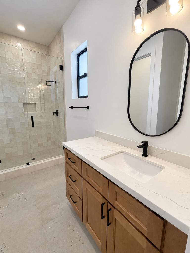 ADU bathroom with tiled walk-in shower and quartz vanity at Brady Estates, Roseville CA